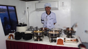 Chef with lunch cooked on board